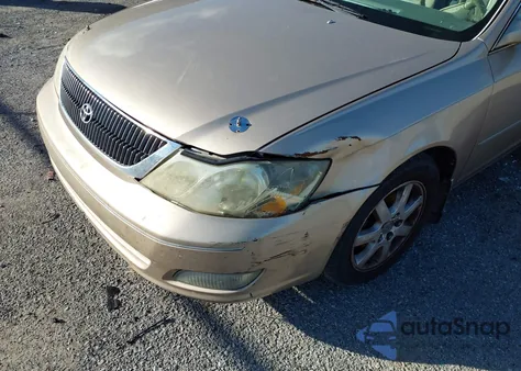 2001 Toyota Avalon Xls z USA, uszkodzony, nr VIN 4T1BF28B11U185075